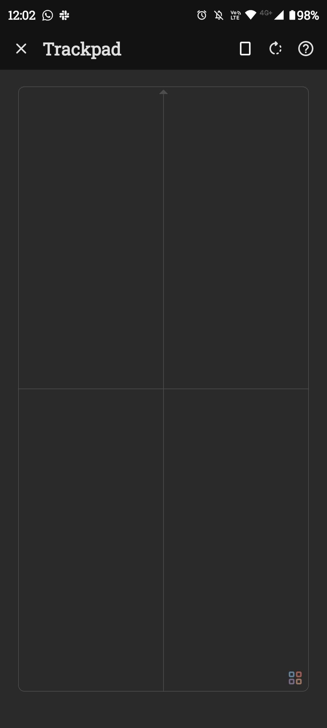 Layar dengan bagian trackpad besar dan tombol menu kecil di atas