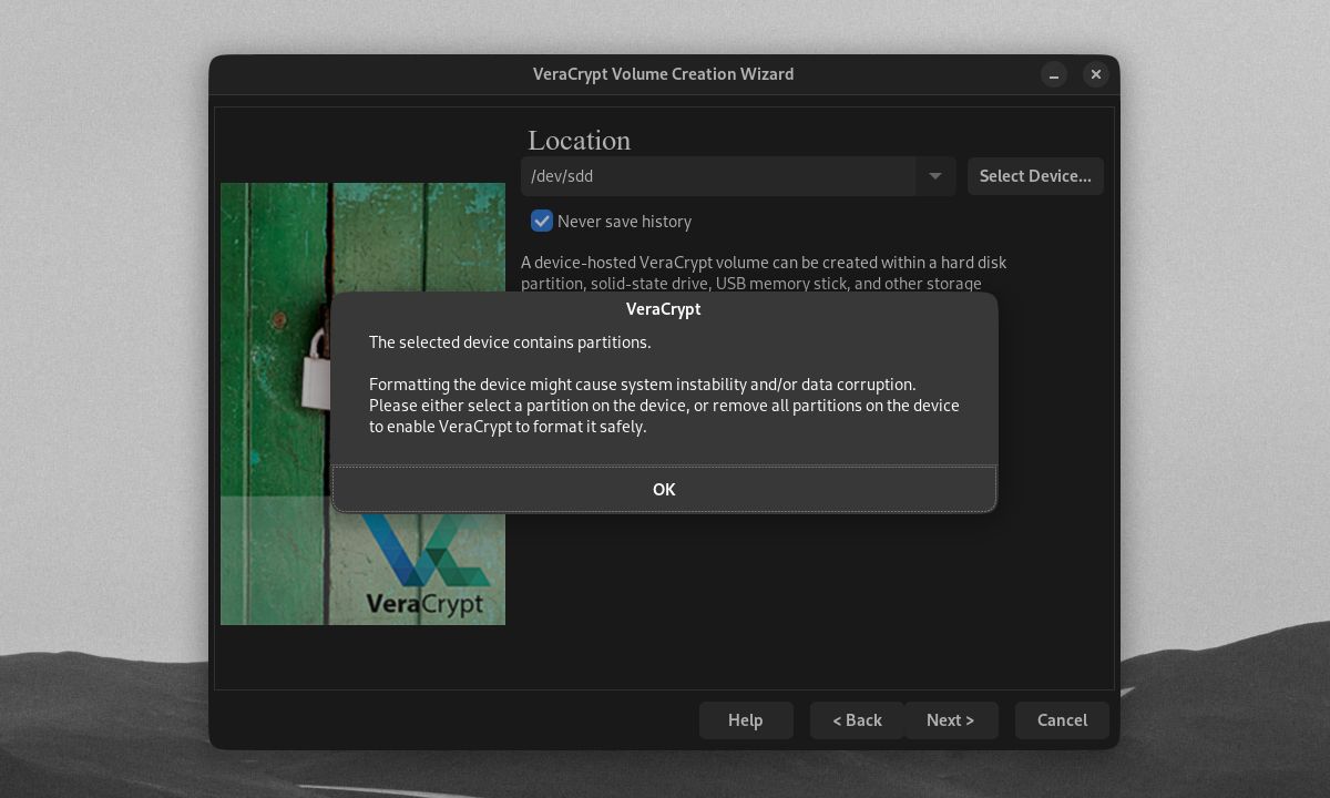 VeraCrypt pop-up menginformasikan perangkat yang dipilih dengan banyak partisi